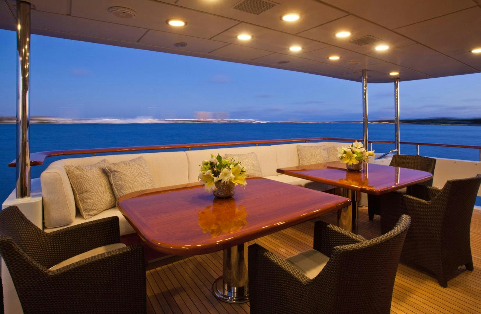a table and chairs in a room aboard LEVERAGE Yacht for Sale