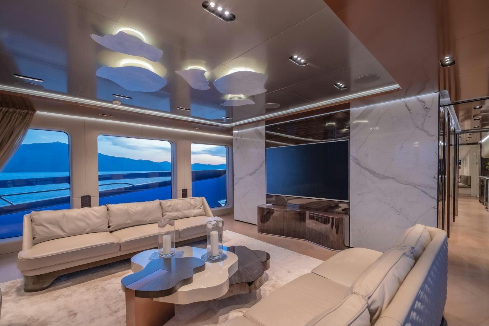 a living room with a large window aboard LA VIE Yacht for Sale