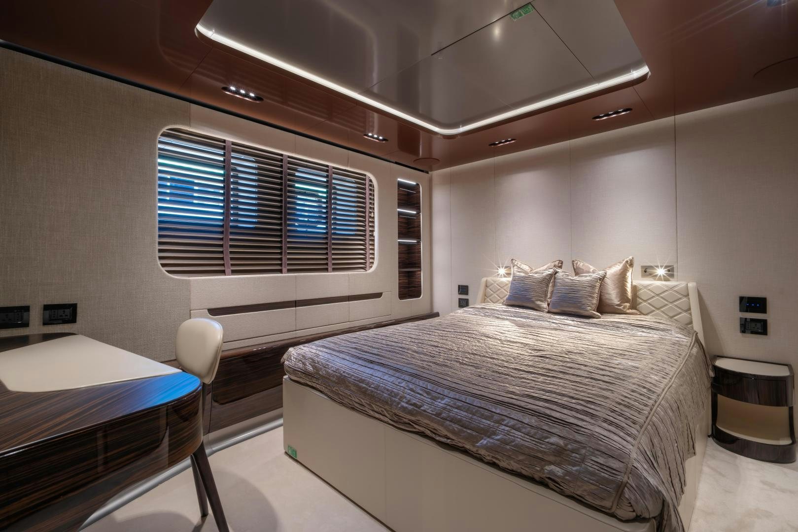 a room with a bed and a window aboard LA VIE Yacht for Sale