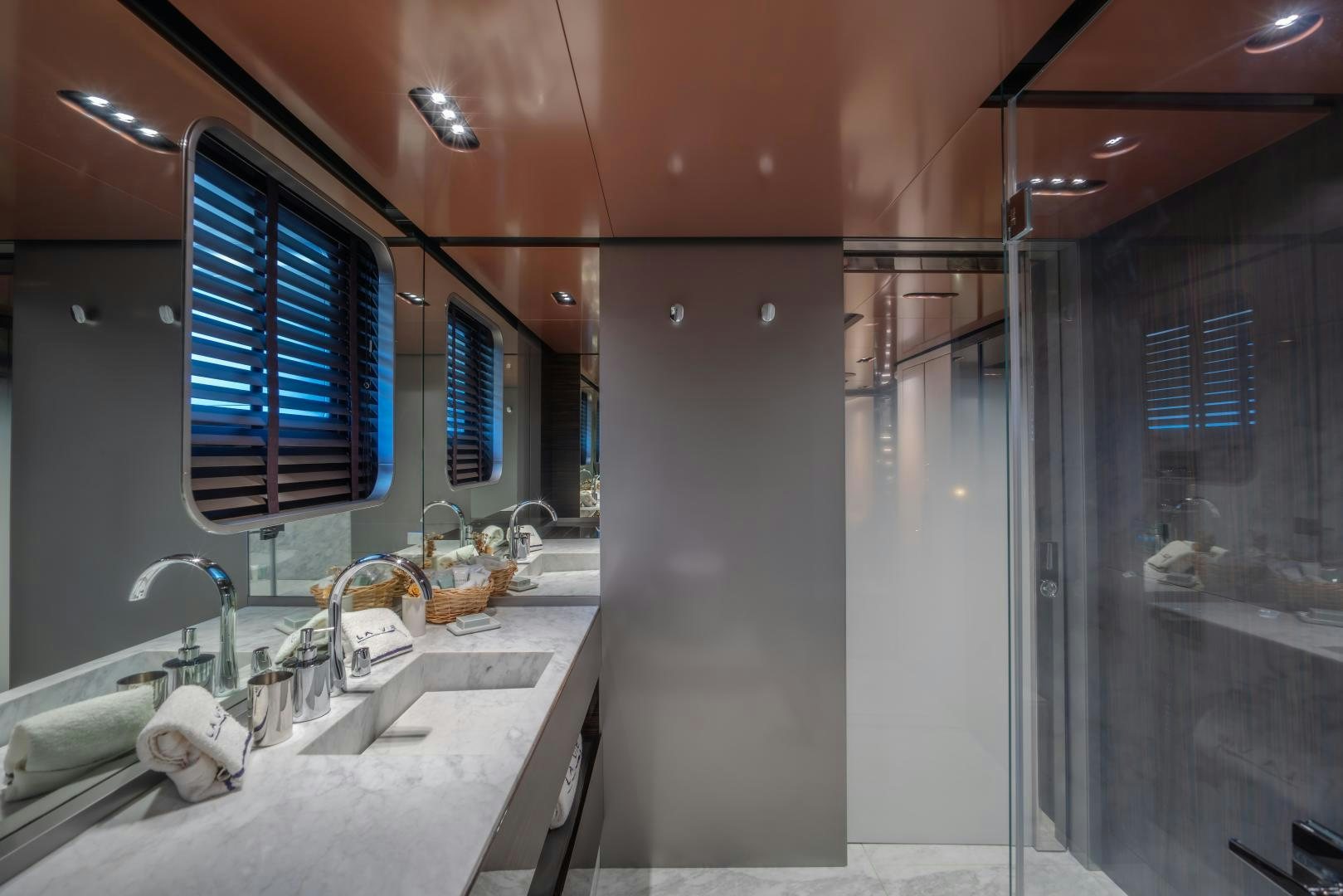 a bathroom with a sink and a shower aboard LA VIE Yacht for Sale