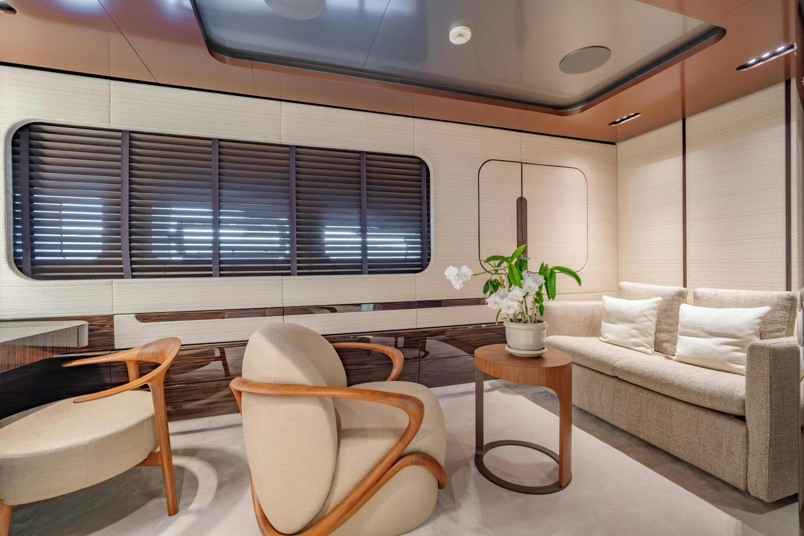 a living room with a couch and a table aboard LA VIE Yacht for Sale