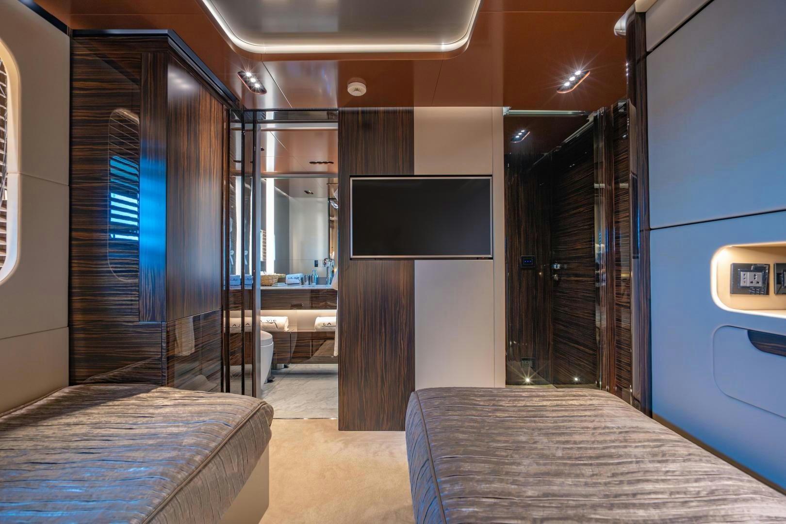 a room with a bed and a tv aboard LA VIE Yacht for Sale