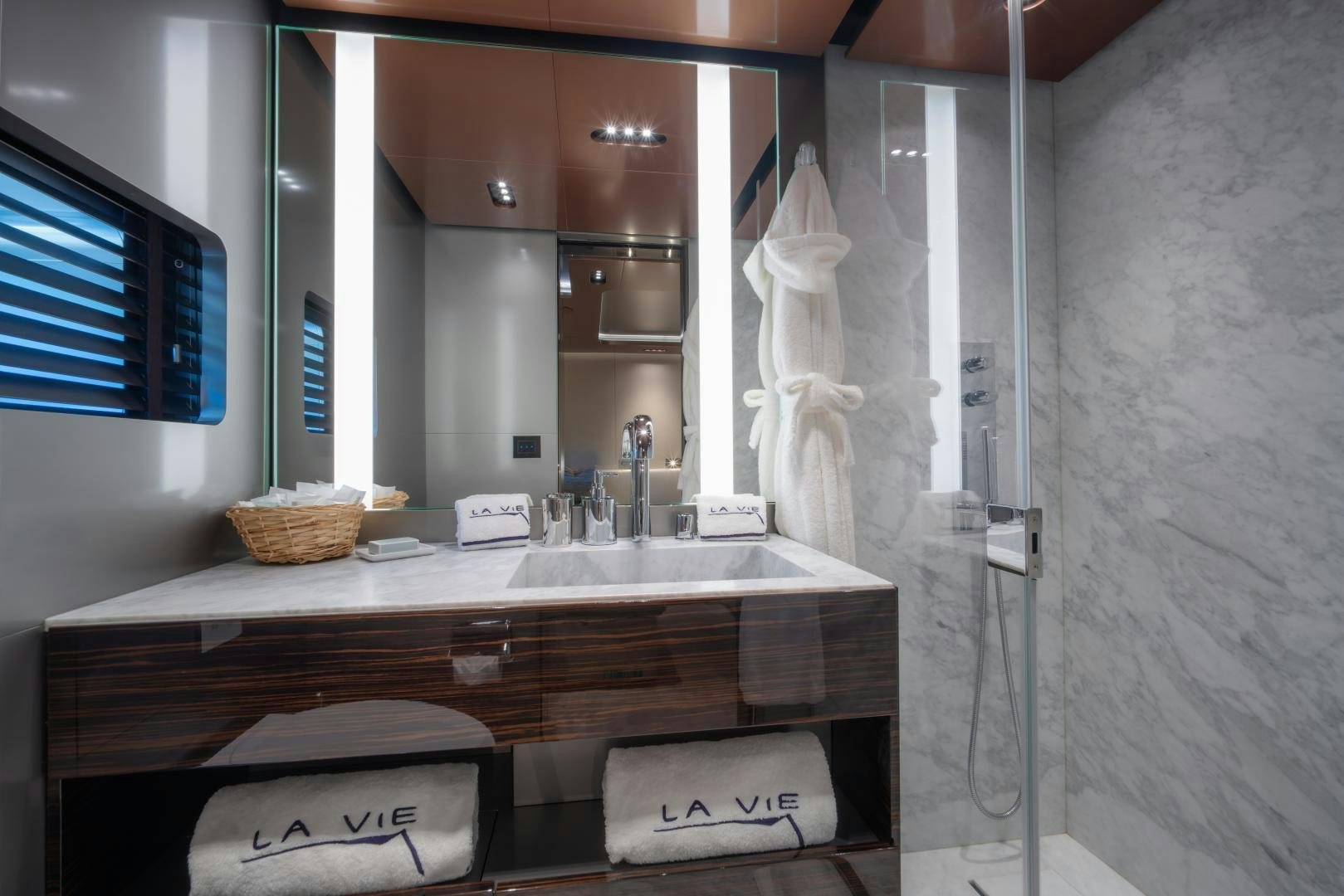 a bathroom with a sink and a mirror aboard LA VIE Yacht for Sale