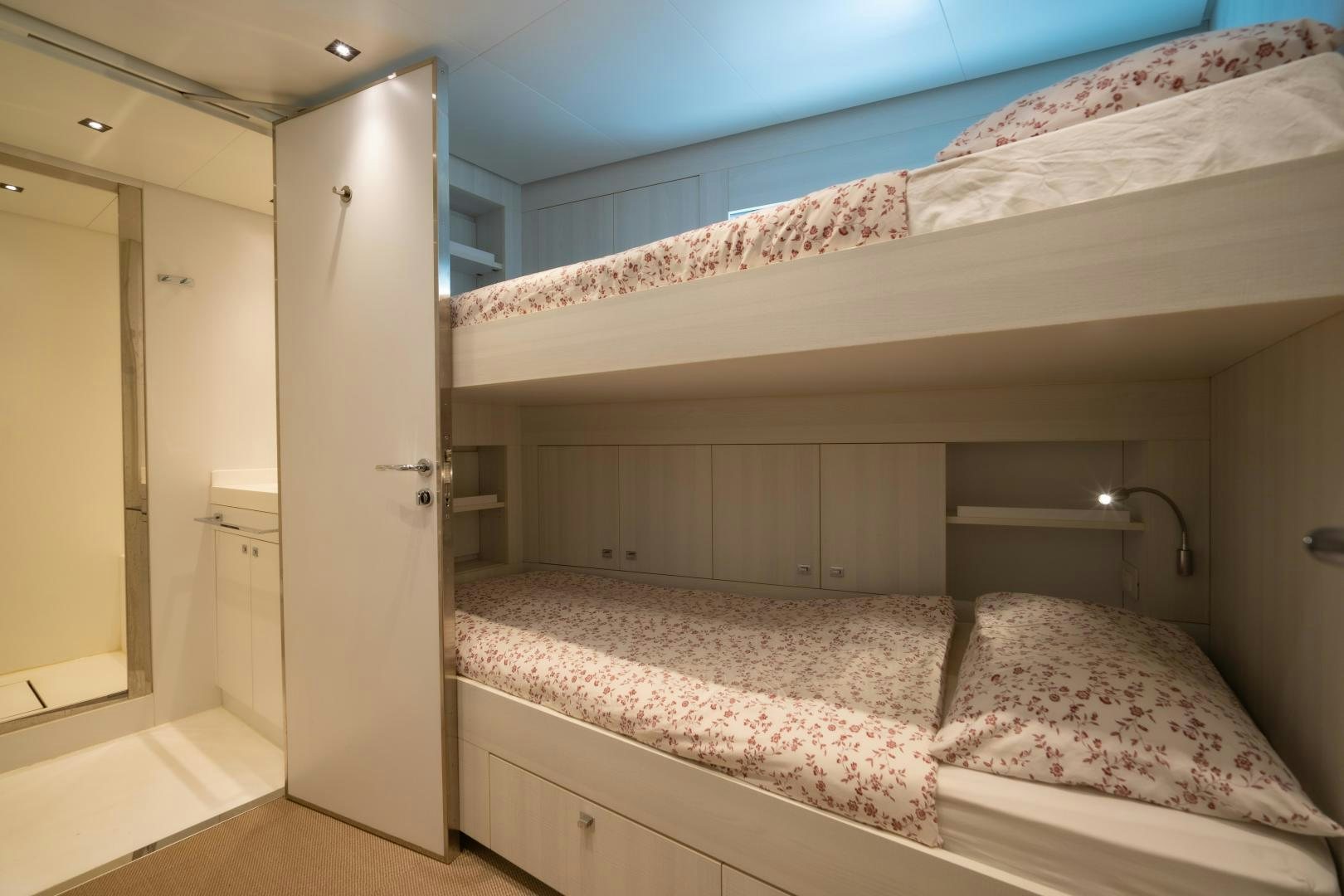 a bedroom with a bed and a closet aboard LA VIE Yacht for Sale