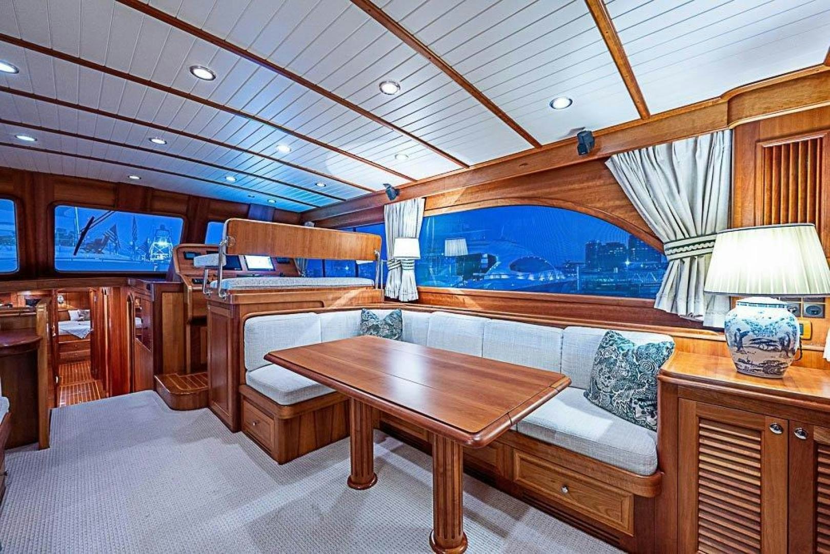 a room with a couch and a table aboard NAMHARA Yacht for Sale