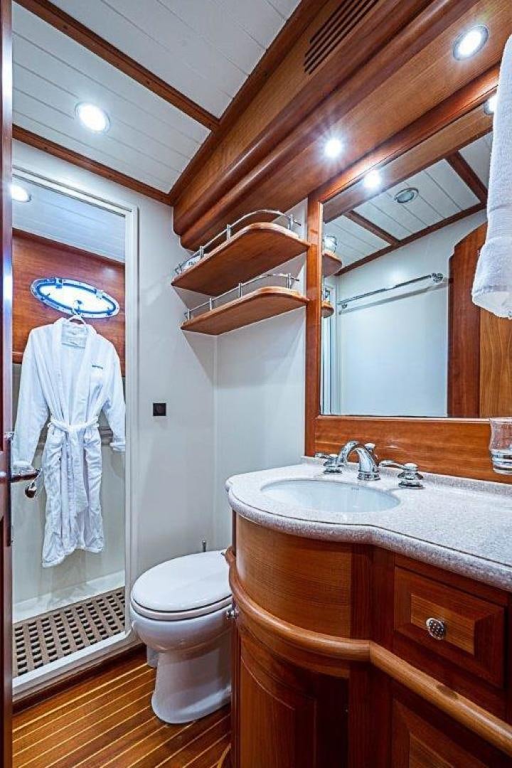 a bathroom with a dress on the wall aboard NAMHARA Yacht for Sale