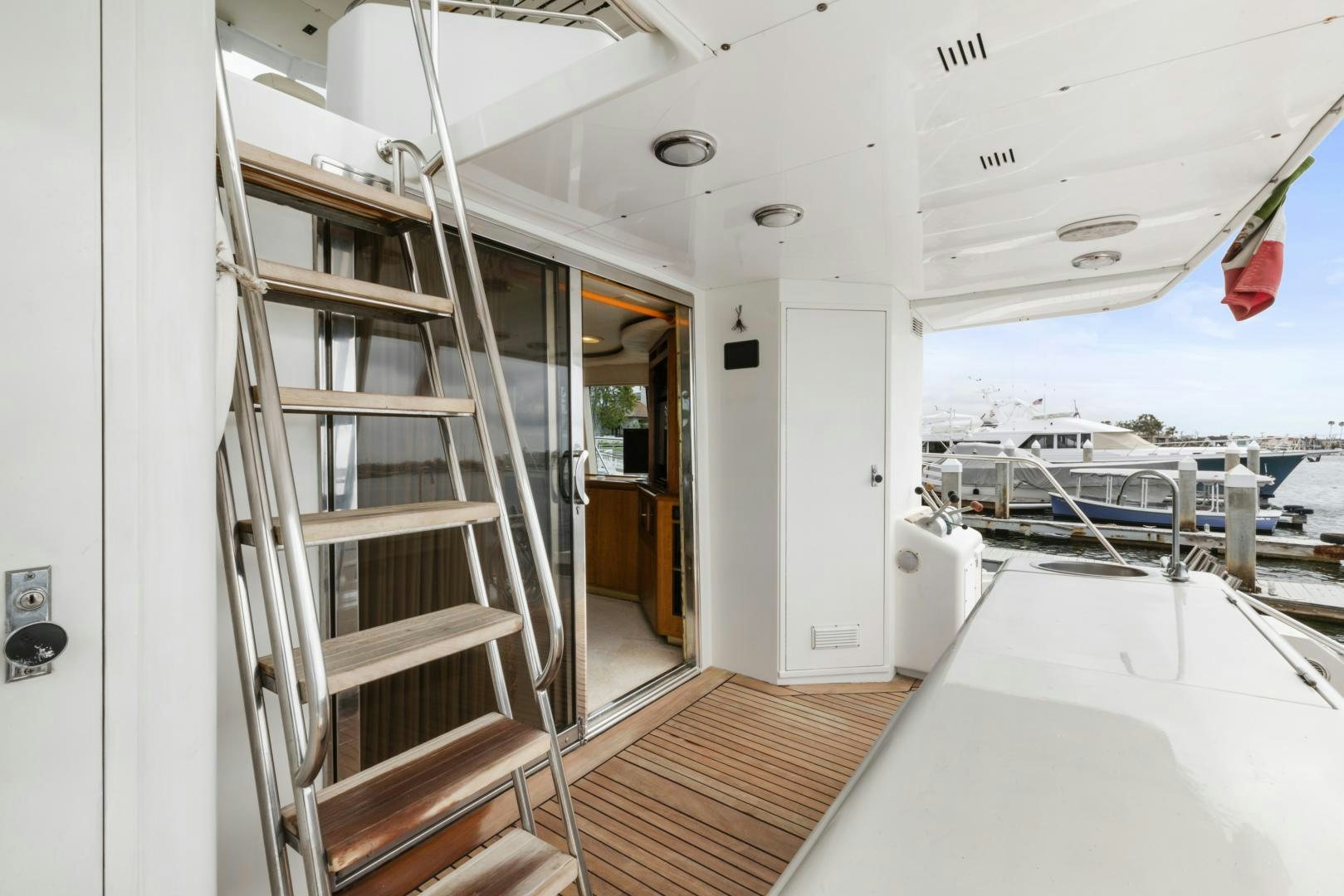 a white room with a ladder and a white wall aboard WANDERLUST Yacht for Sale