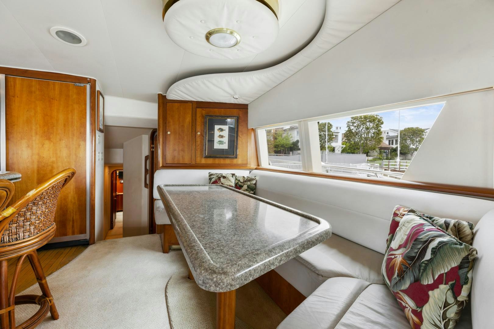 a living room with a table and chairs aboard WANDERLUST Yacht for Sale