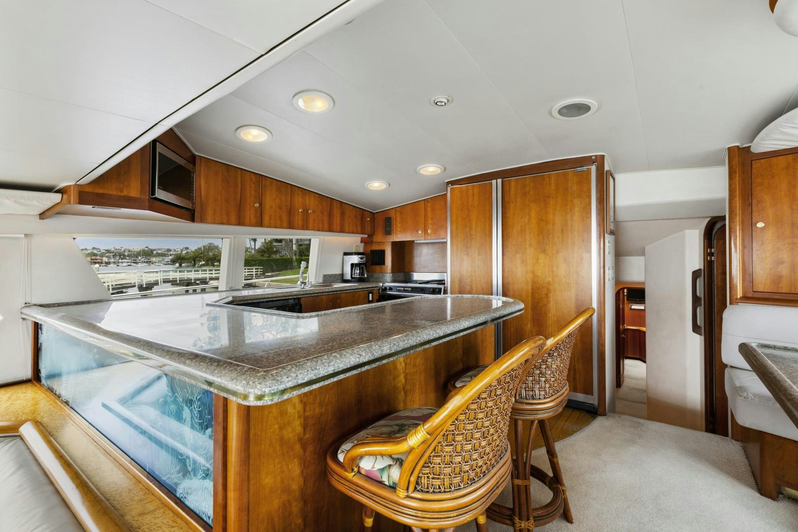 a kitchen with a bar and a dining table aboard WANDERLUST Yacht for Sale