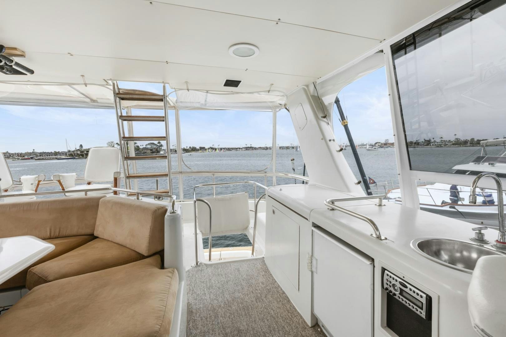 a boat with a sink and a couch aboard WANDERLUST Yacht for Sale