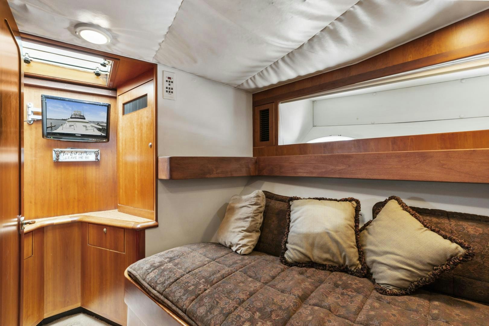 a bed with pillows aboard WANDERLUST Yacht for Sale