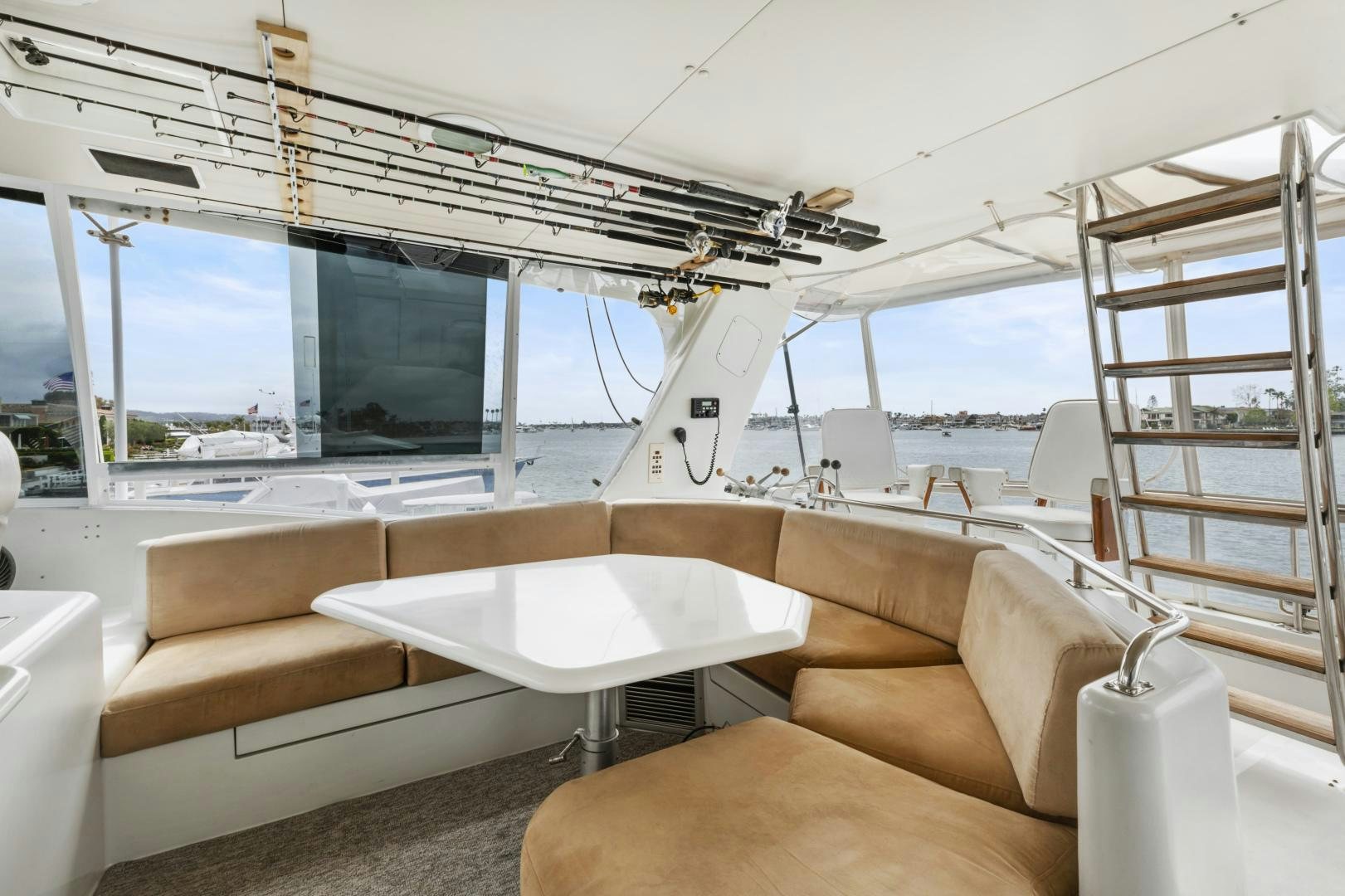 a boat with a table and chairs aboard WANDERLUST Yacht for Sale