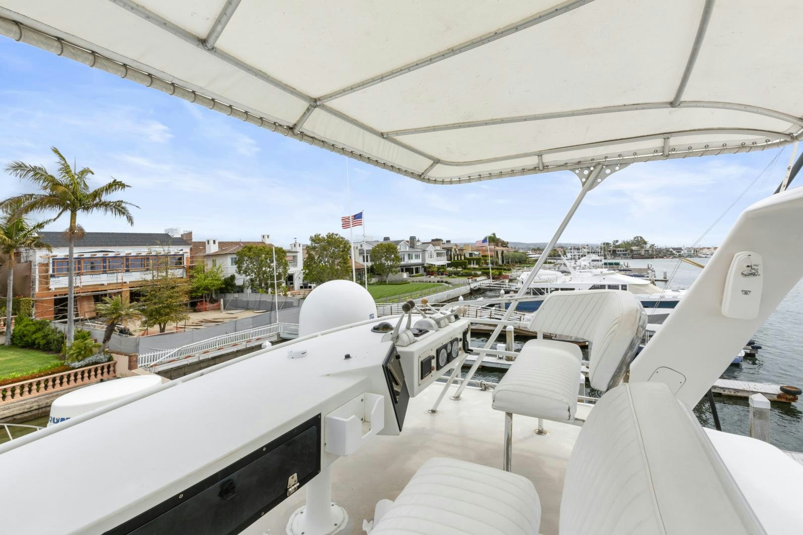 a deck with chairs and tables aboard WANDERLUST Yacht for Sale