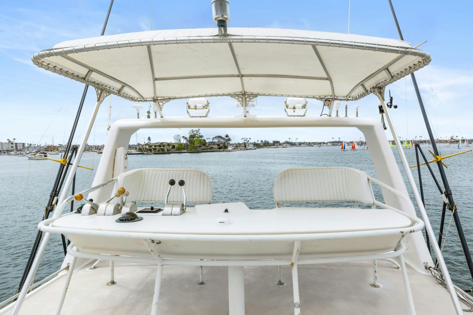 a white boat on the water aboard WANDERLUST Yacht for Sale