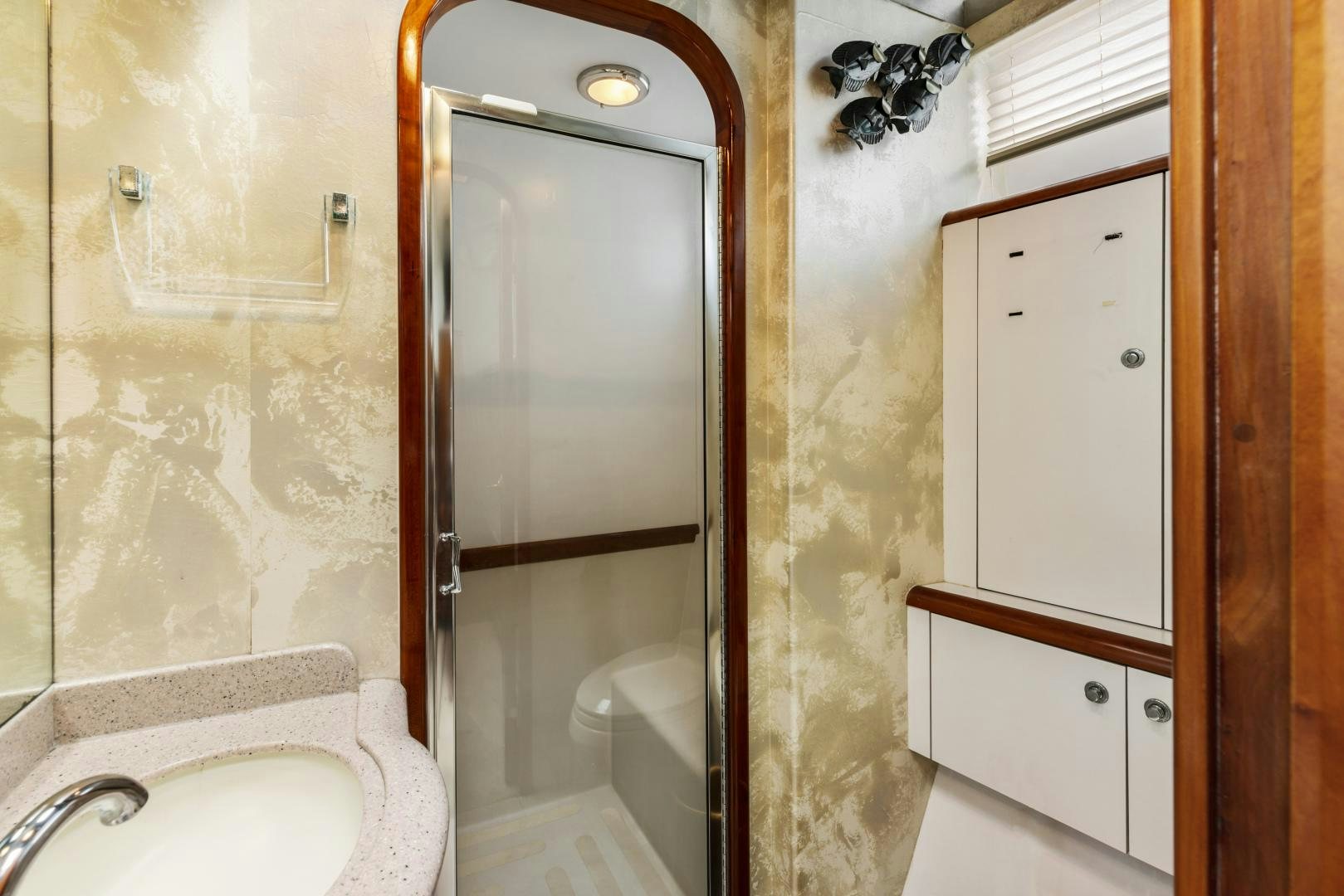 a bathroom with a sink and a shower aboard WANDERLUST Yacht for Sale