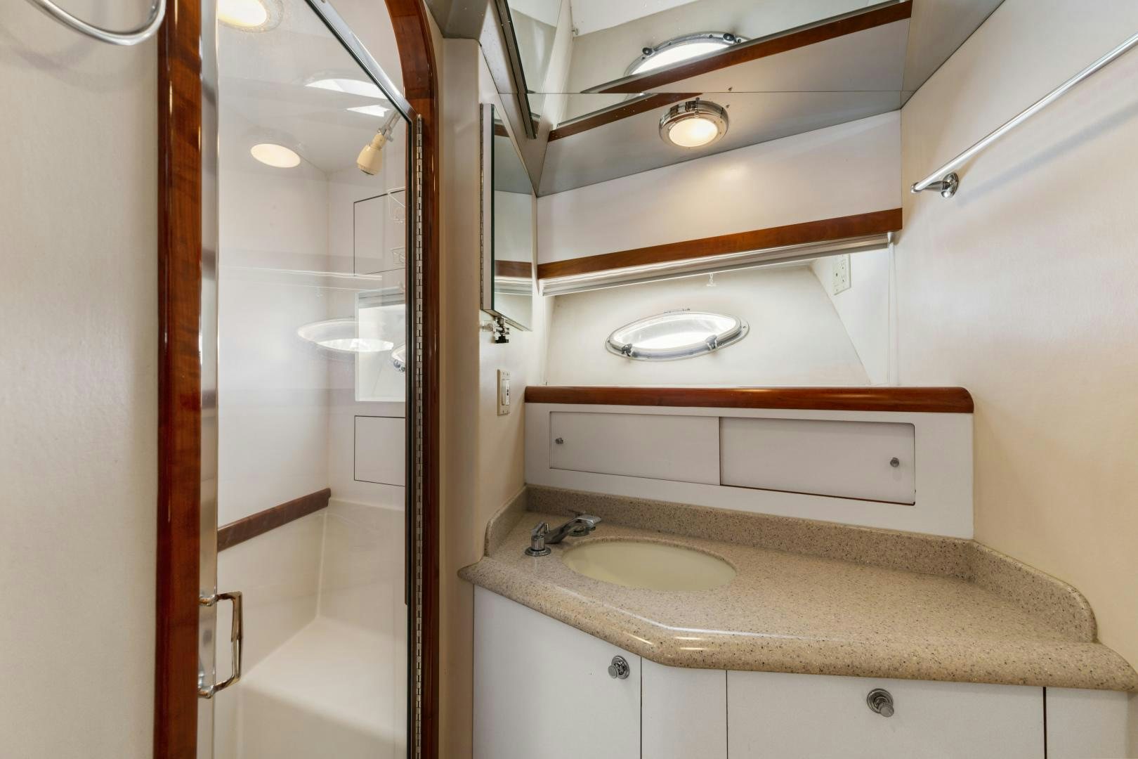 a bathroom with a sink and cabinets aboard WANDERLUST Yacht for Sale