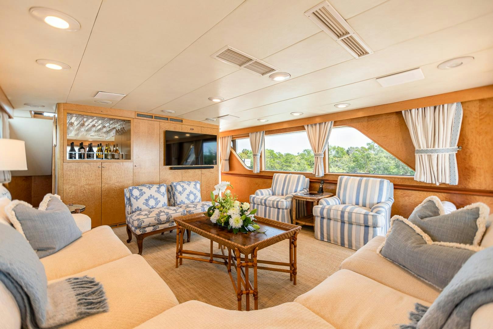 a living room with a table and chairs aboard SIRENE Yacht for Sale