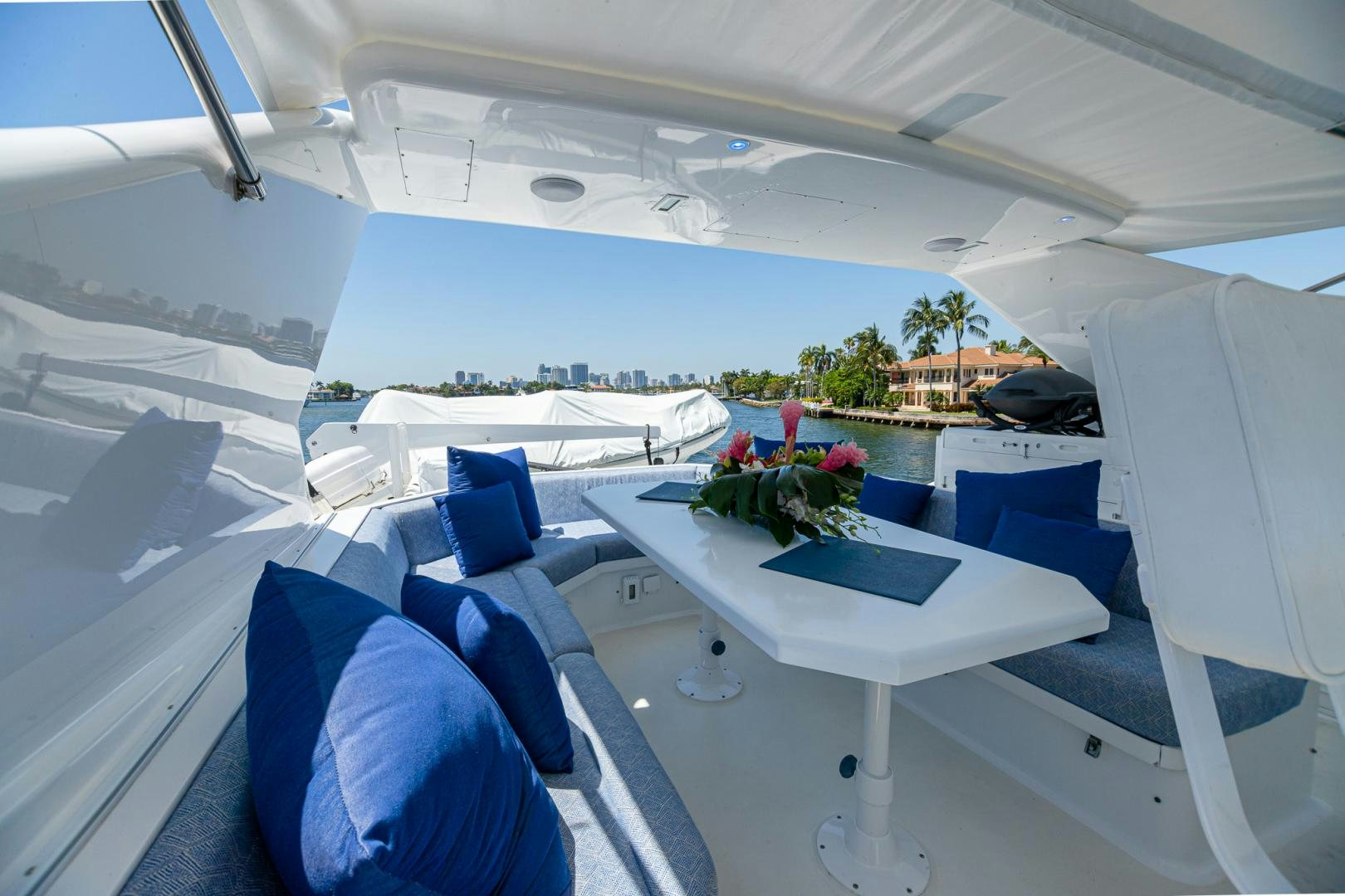 a white tent with blue chairs and tables and a pool aboard SIRENE Yacht for Sale