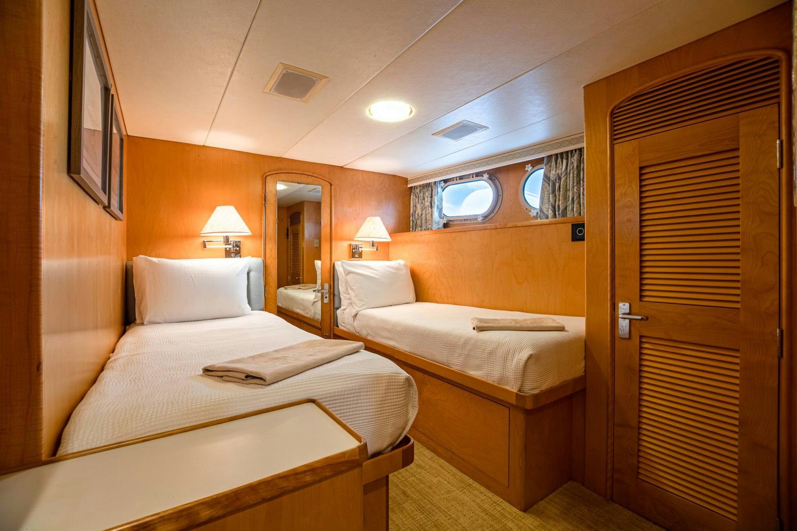 a room with two beds aboard SIRENE Yacht for Sale