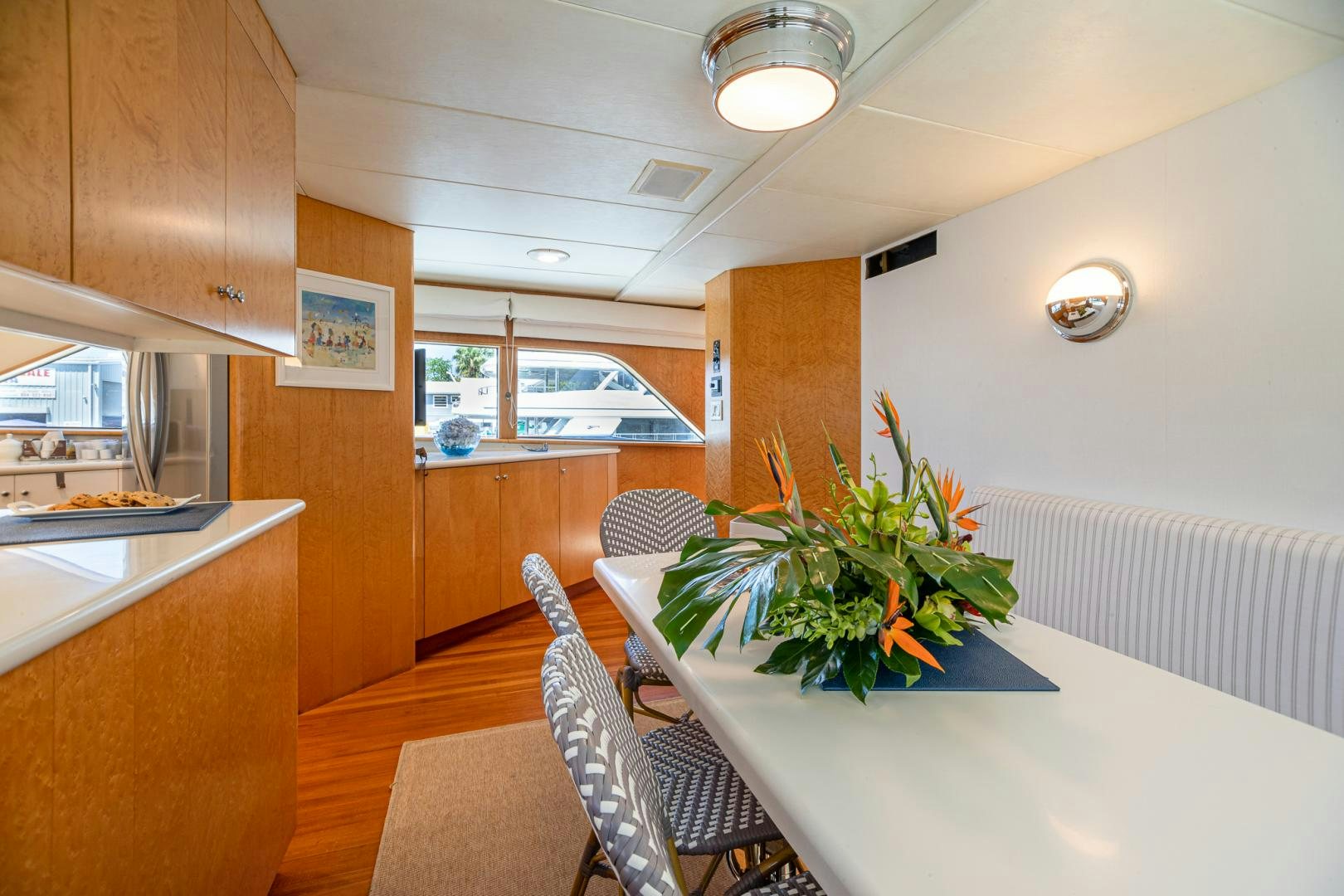 a kitchen with a table and chairs aboard SIRENE Yacht for Sale
