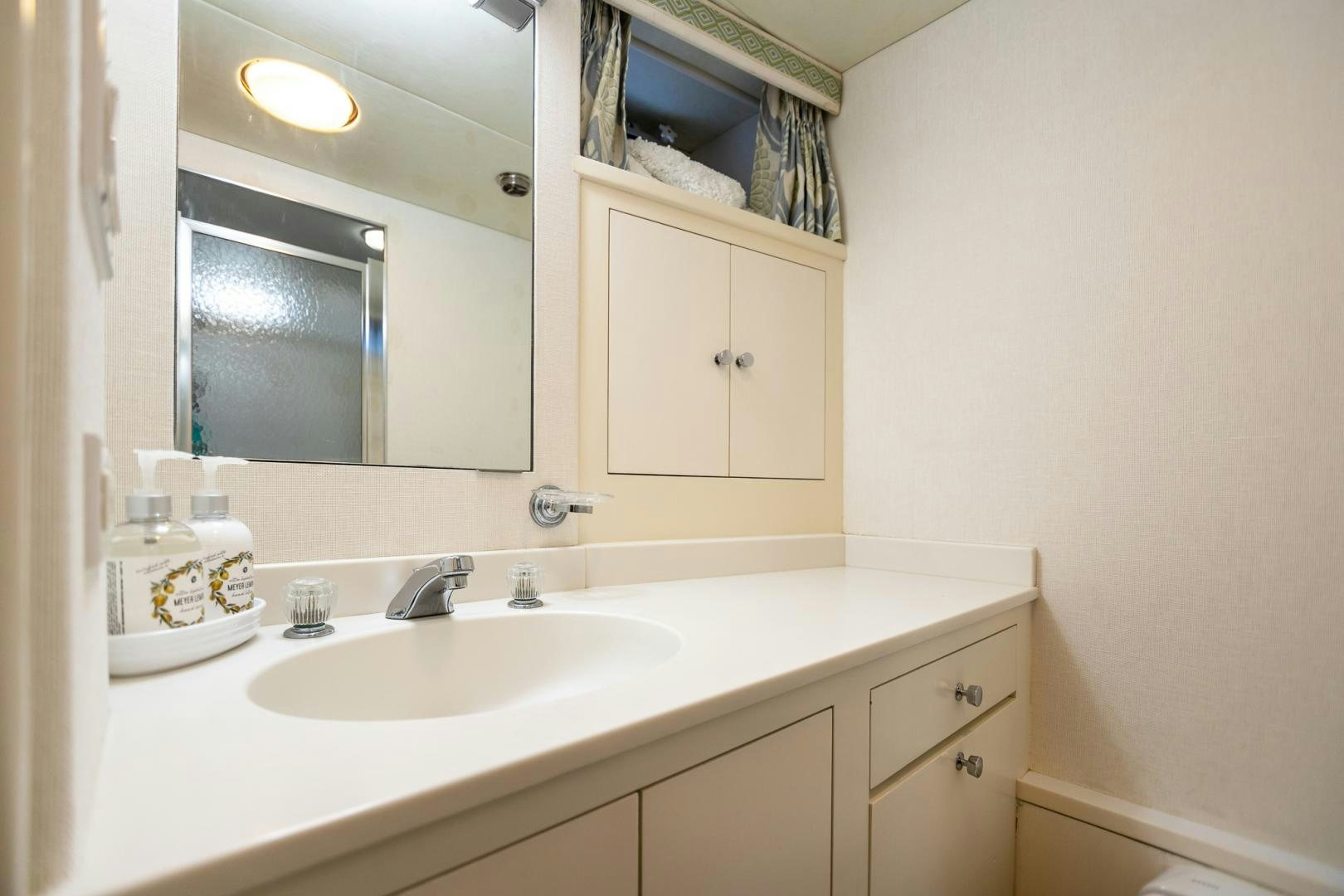 a bathroom with a large mirror aboard SIRENE Yacht for Sale