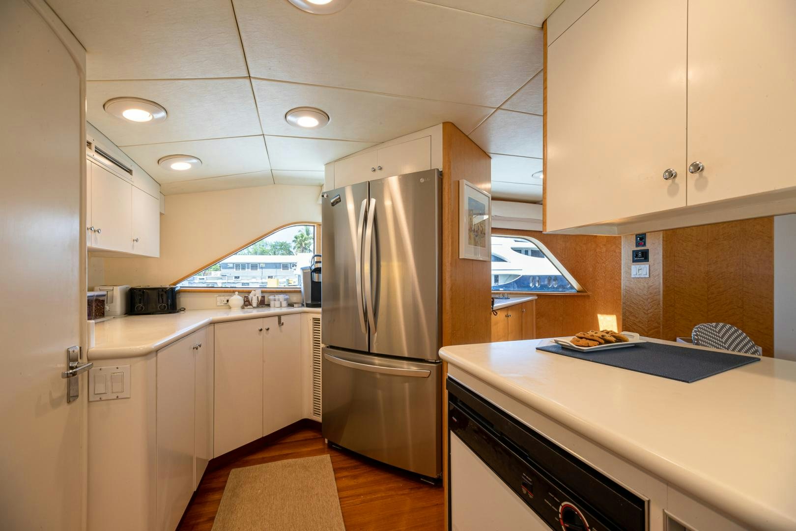 a kitchen with white cabinets aboard SIRENE Yacht for Sale