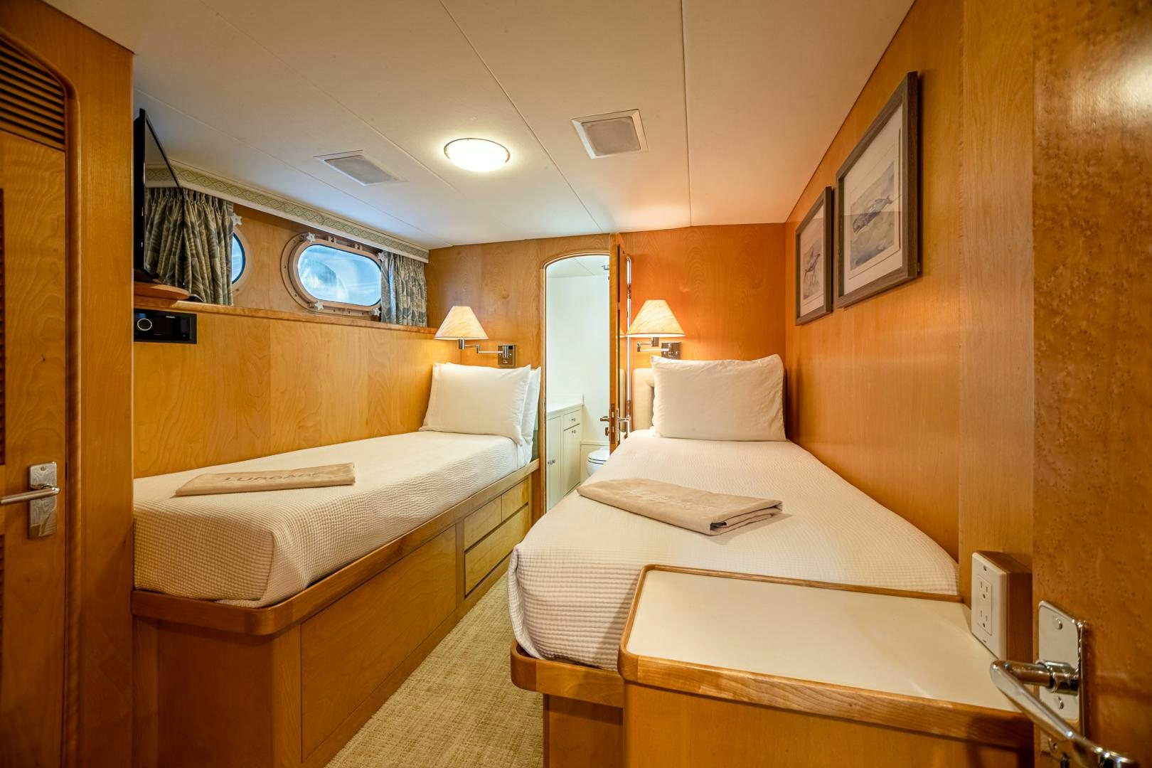 a room with two beds aboard SIRENE Yacht for Sale