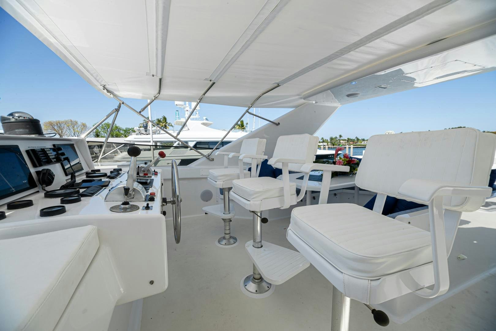 a room with white chairs and tables aboard SIRENE Yacht for Sale