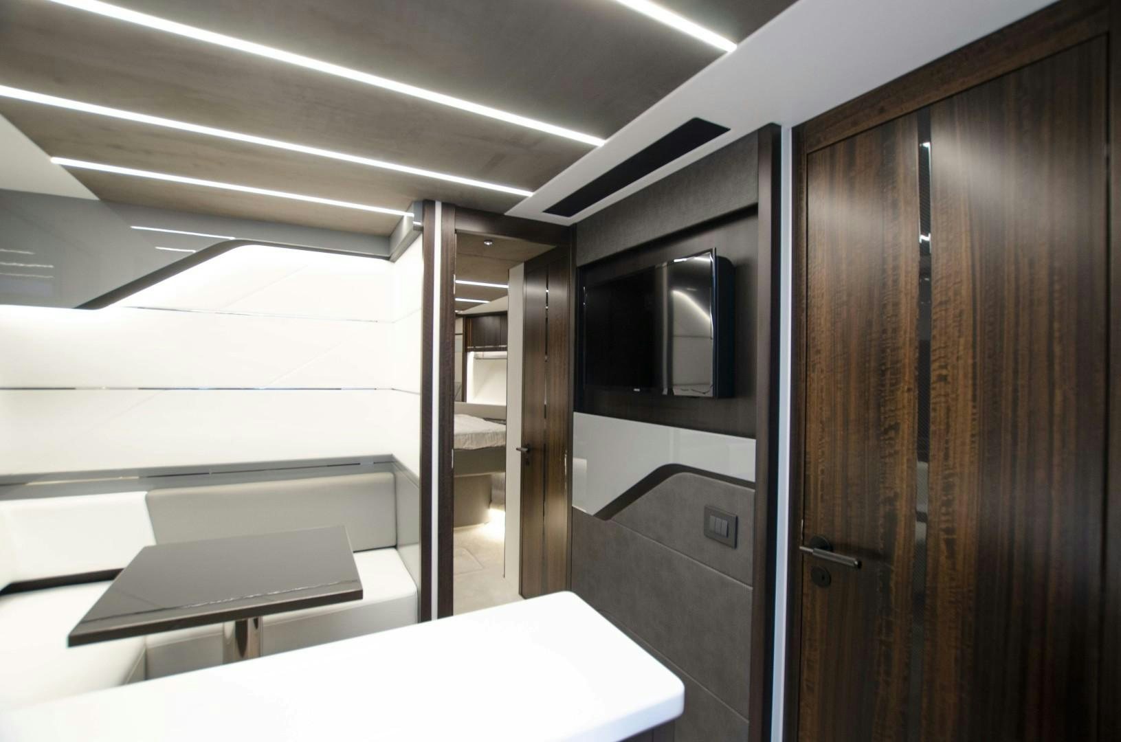 a room with a desk and a computer aboard DOUBLE OR NOTHING Yacht for Sale