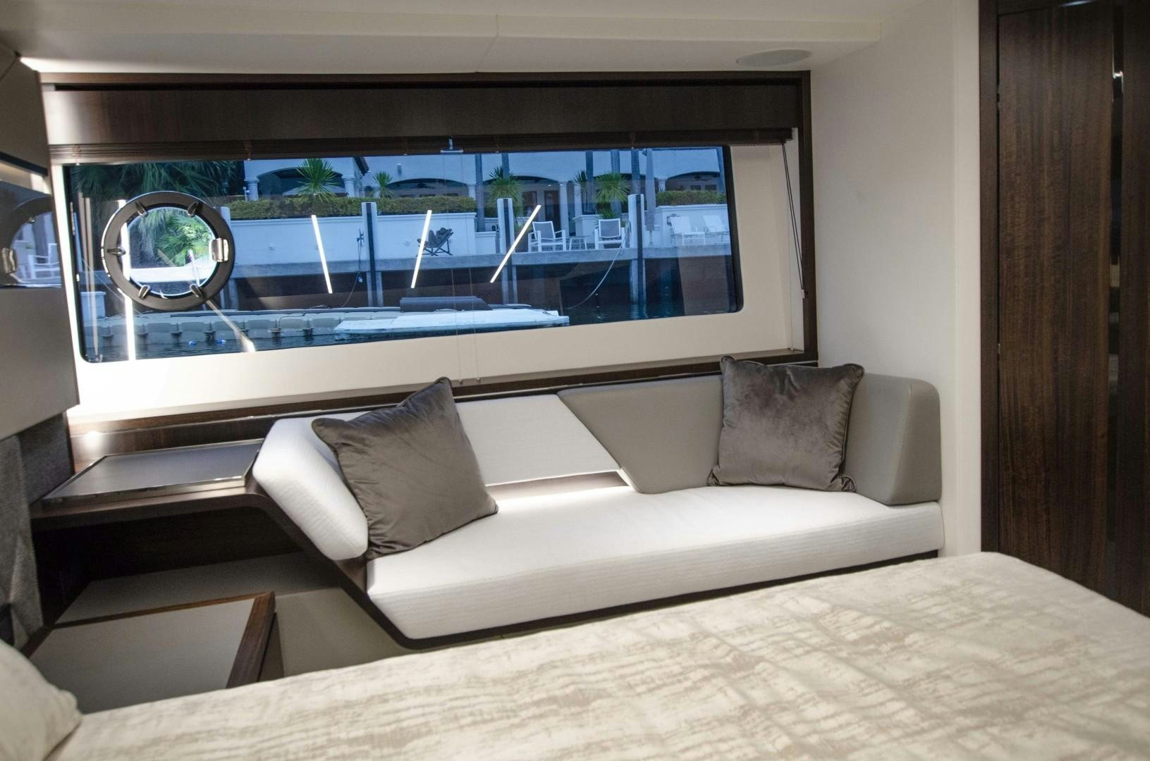 a couch with pillows in a room aboard DOUBLE OR NOTHING Yacht for Sale