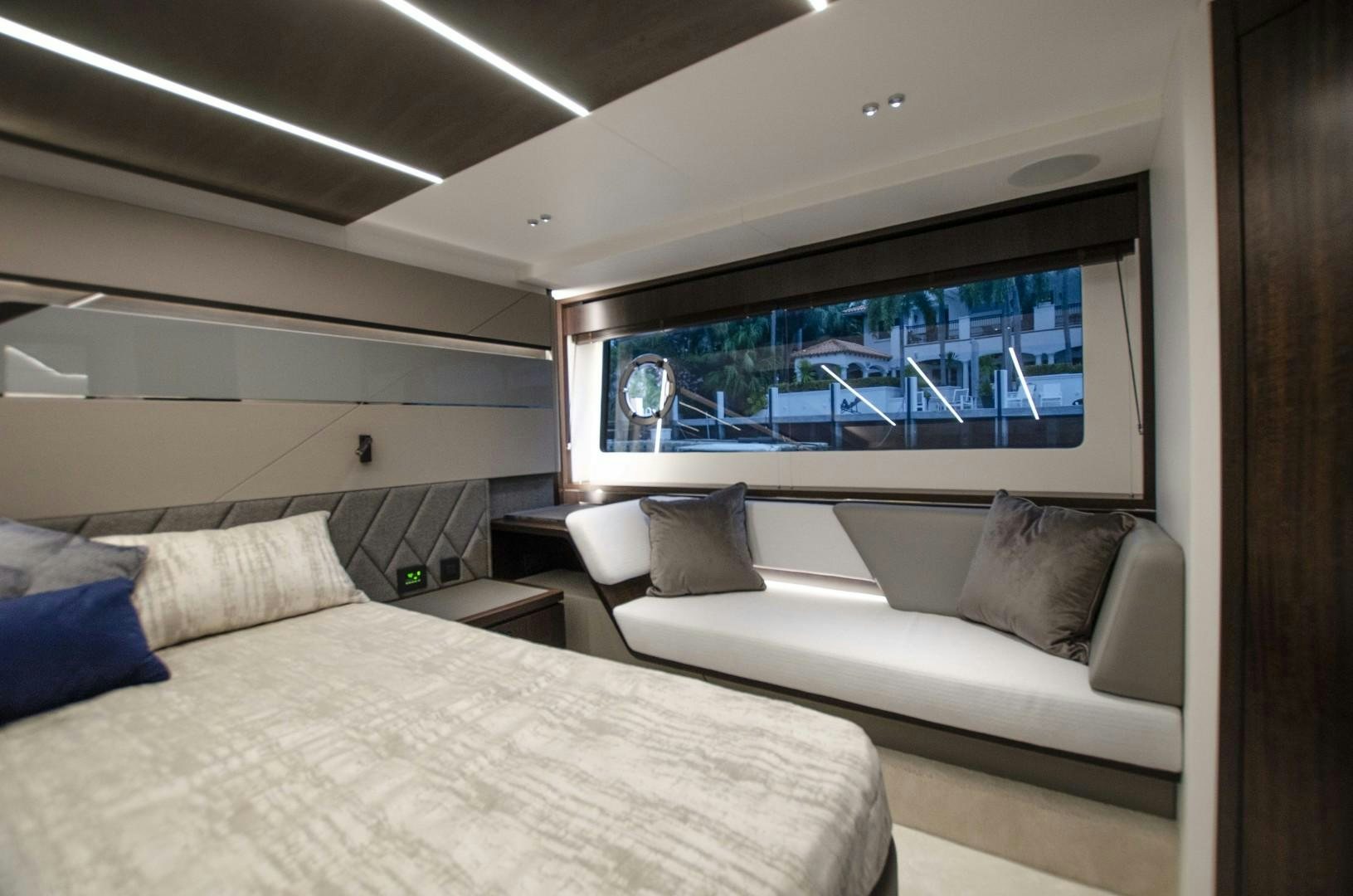 a room with a bed and a television aboard DOUBLE OR NOTHING Yacht for Sale