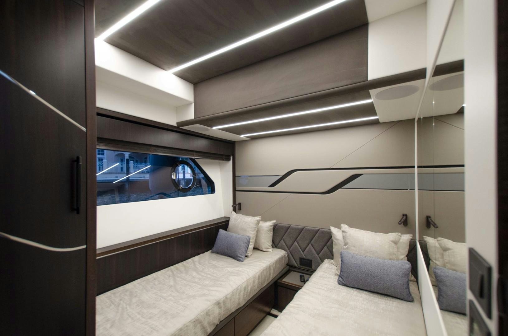 a room with a bed and a television aboard DOUBLE OR NOTHING Yacht for Sale