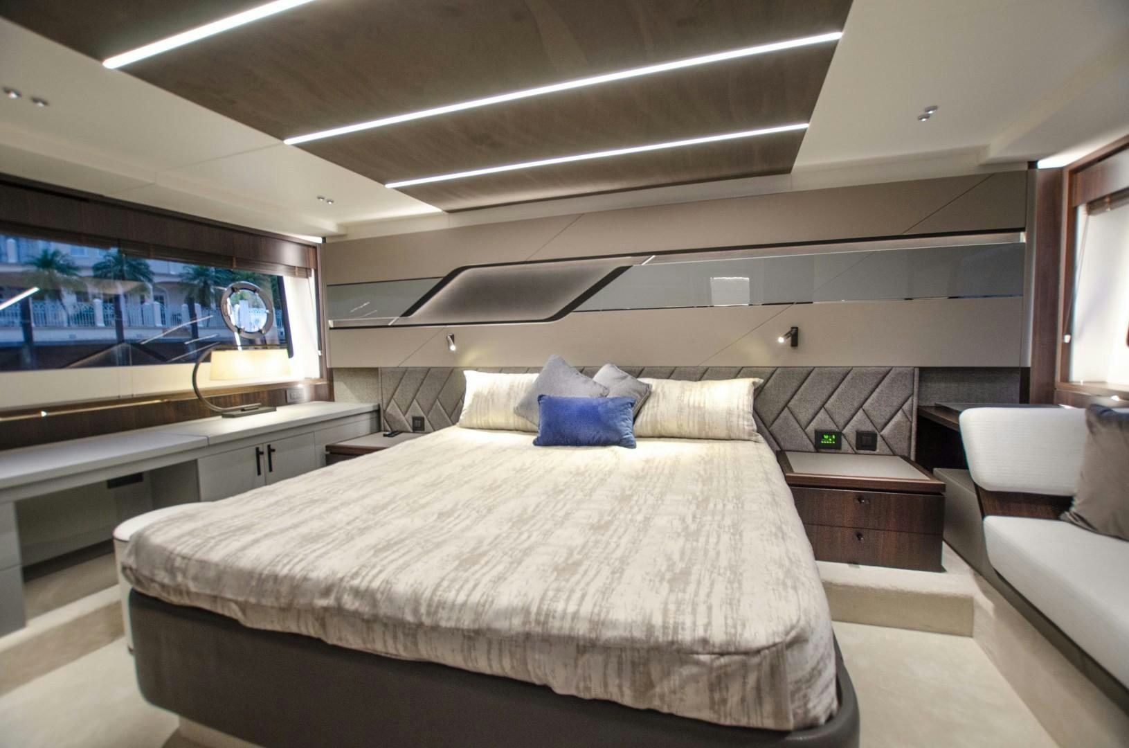 a room with a bed and a television aboard DOUBLE OR NOTHING Yacht for Sale