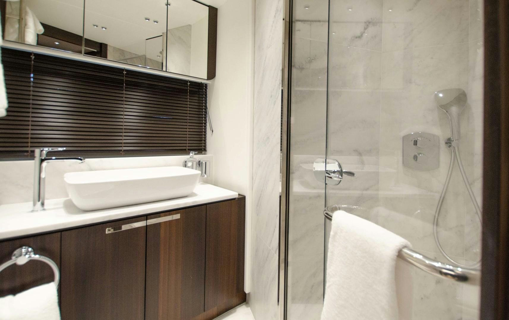 a bathroom with a glass shower aboard DOUBLE OR NOTHING Yacht for Sale