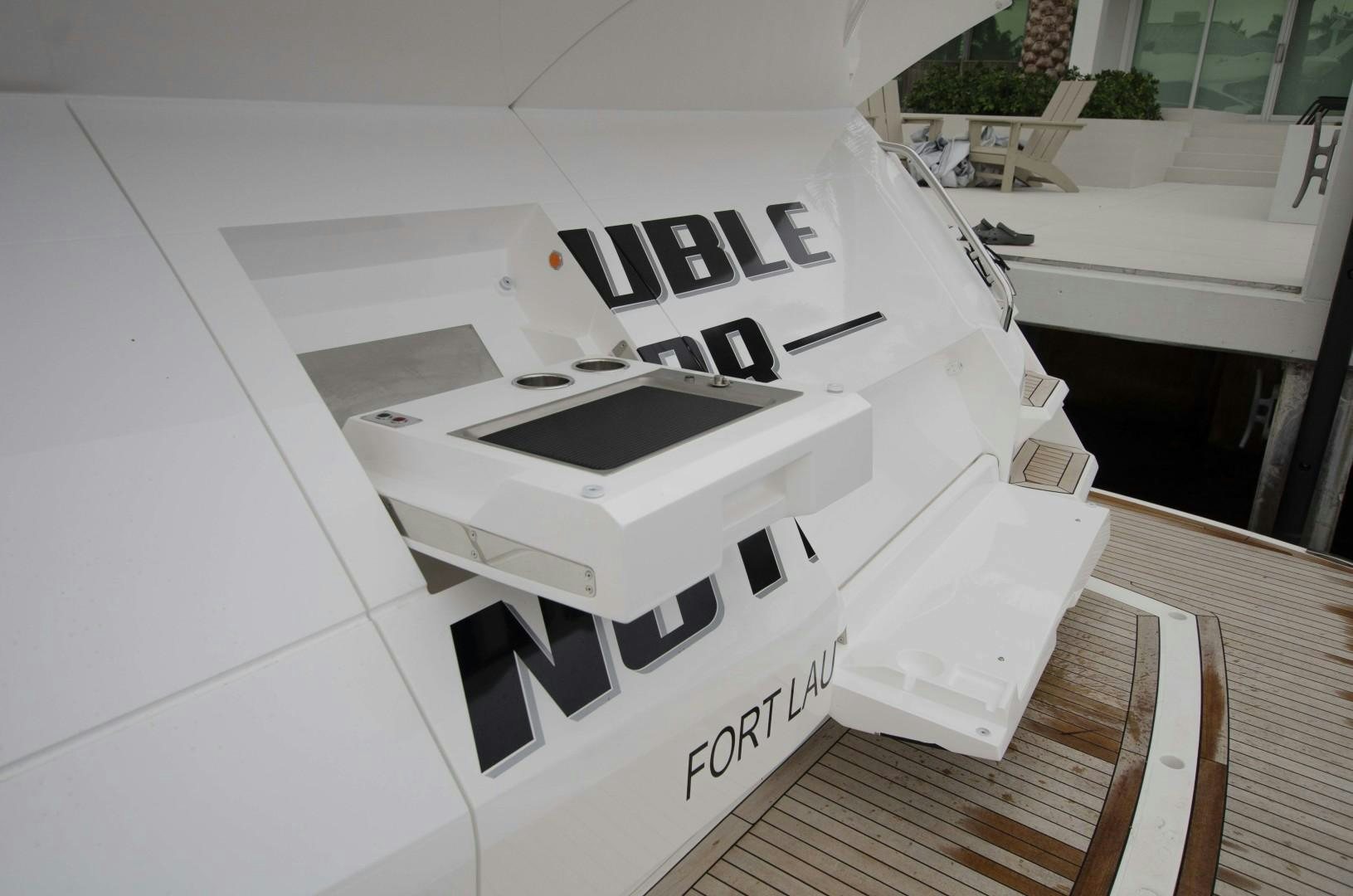 a white building with a sign on it aboard DOUBLE OR NOTHING Yacht for Sale