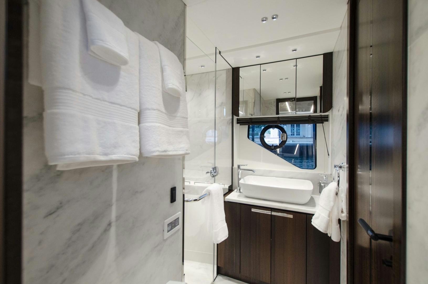 a bathroom with a mirror and a sink aboard DOUBLE OR NOTHING Yacht for Sale