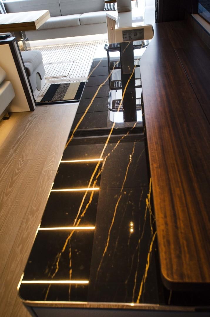 a model of a rocket on a wooden surface aboard DOUBLE OR NOTHING Yacht for Sale