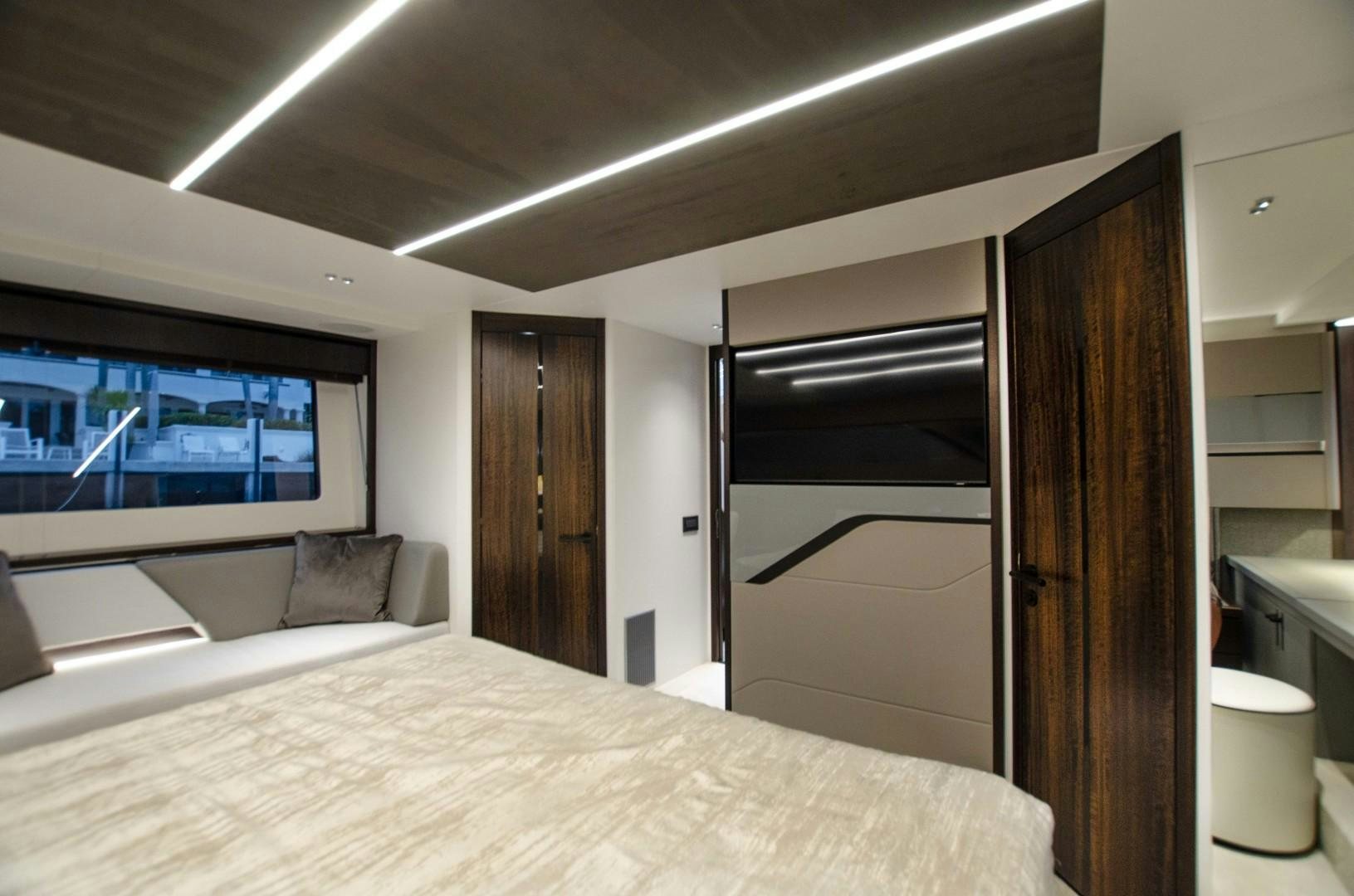 a bedroom with a bed and a closet aboard DOUBLE OR NOTHING Yacht for Sale