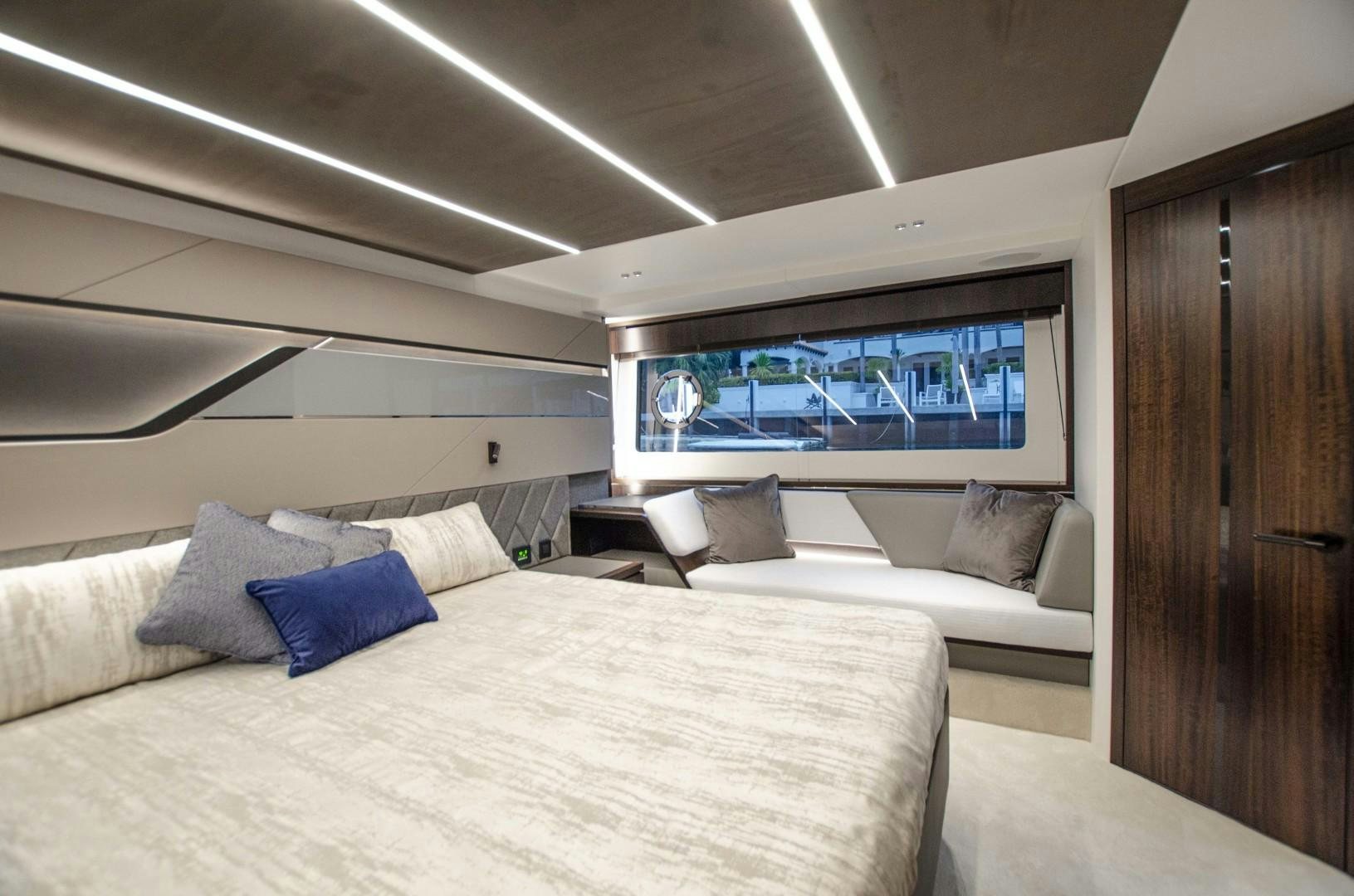 a bed with a white bed spread aboard DOUBLE OR NOTHING Yacht for Sale