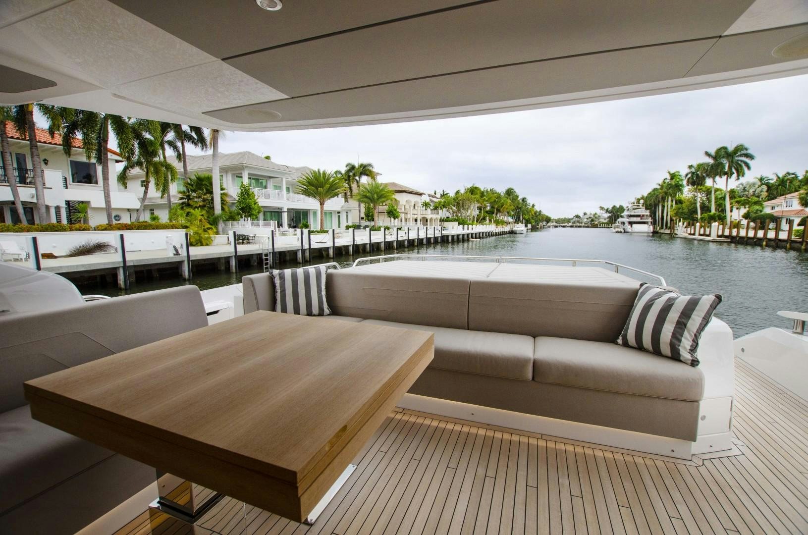 a living room with a couch and a table aboard DOUBLE OR NOTHING Yacht for Sale