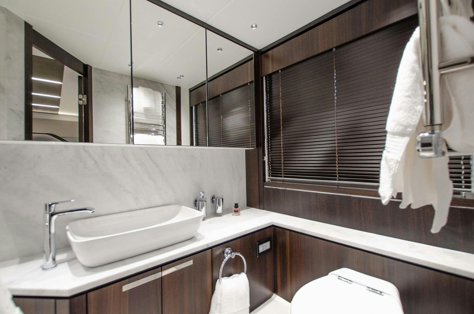 a bathroom with a sink and a mirror aboard DOUBLE OR NOTHING Yacht for Sale