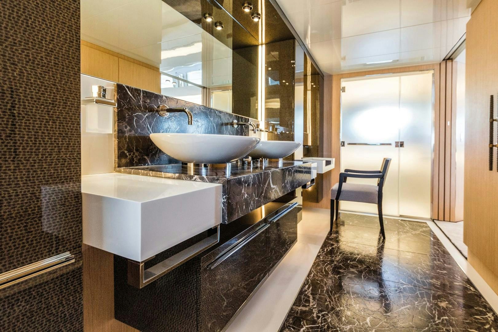 a modern bathroom with marble counter tops aboard BOOMSHAKALAKA Yacht for Sale