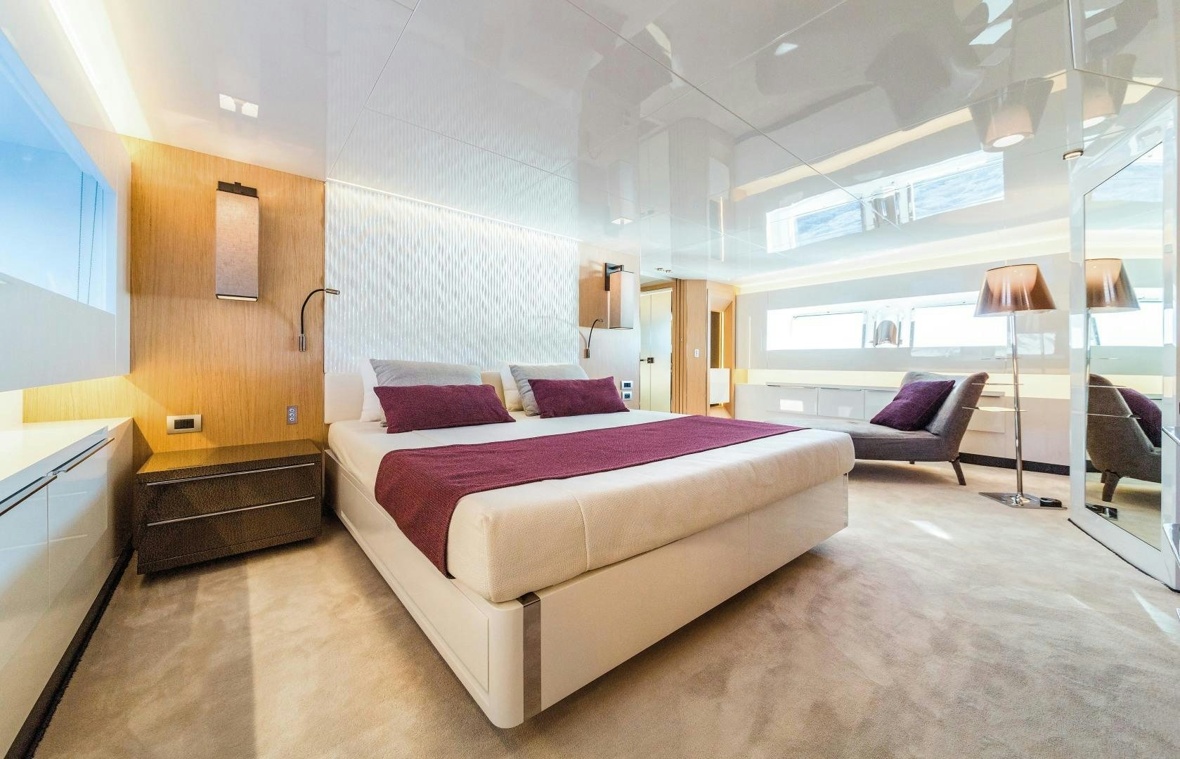 a large bedroom with a bed aboard BOOMSHAKALAKA Yacht for Sale