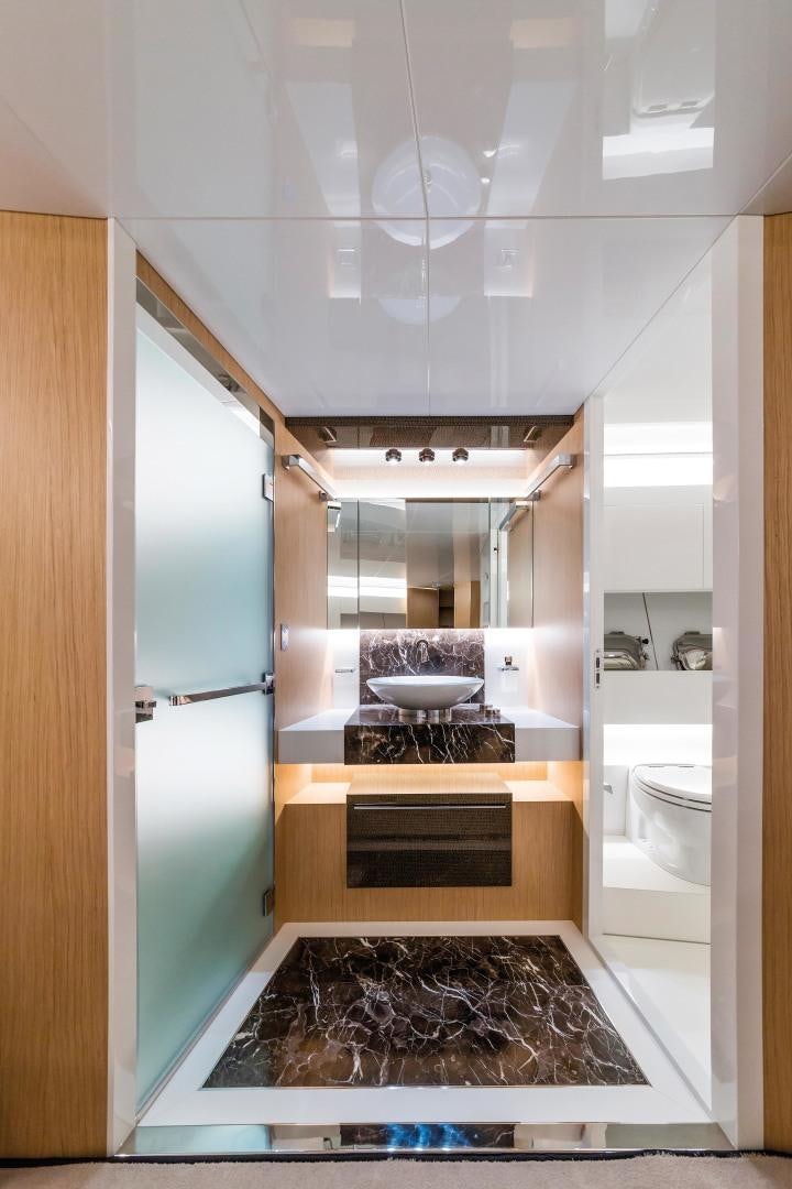 a kitchen with a stove and a sink aboard BOOMSHAKALAKA Yacht for Sale
