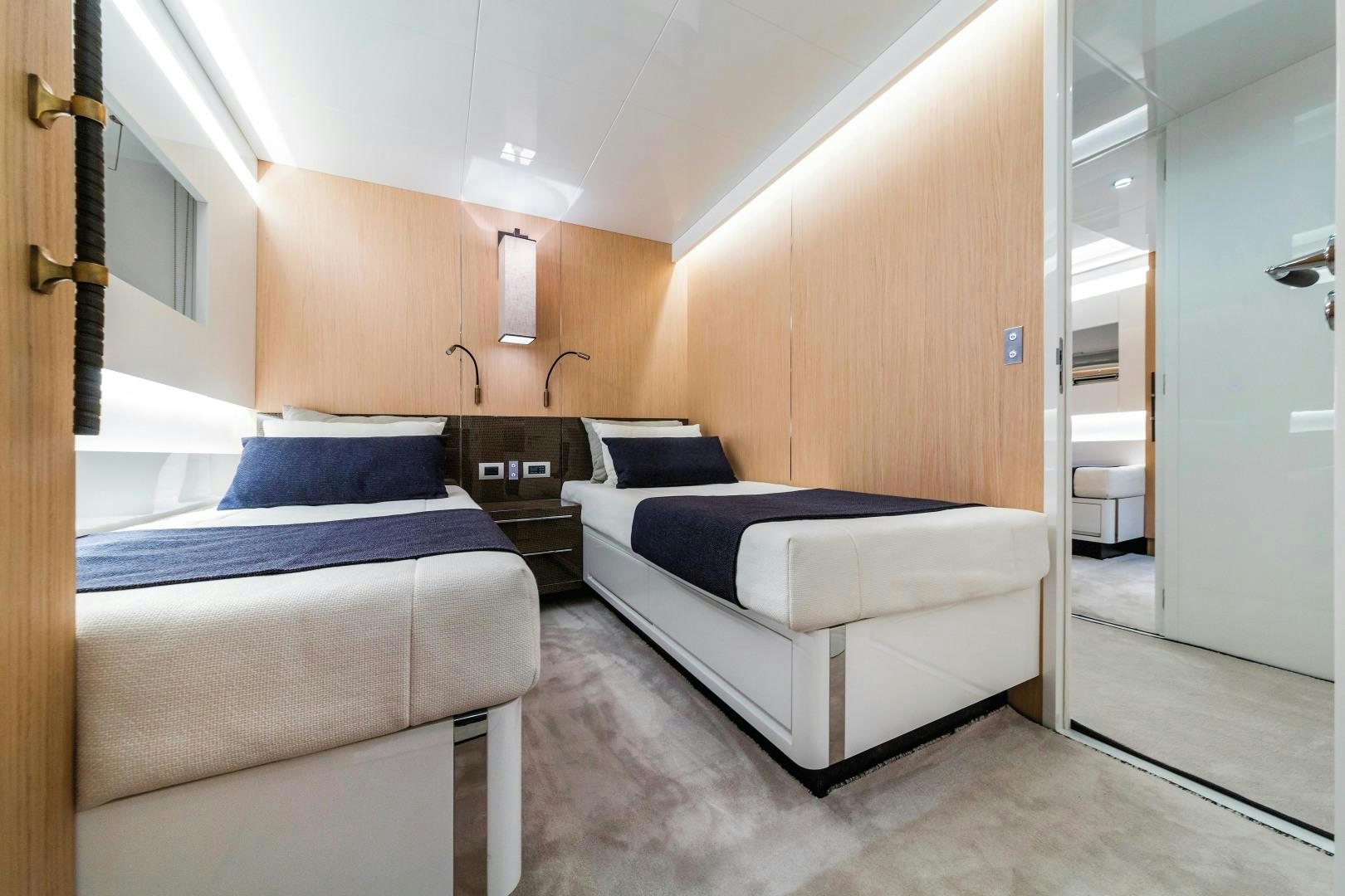 a room with two beds aboard BOOMSHAKALAKA Yacht for Sale