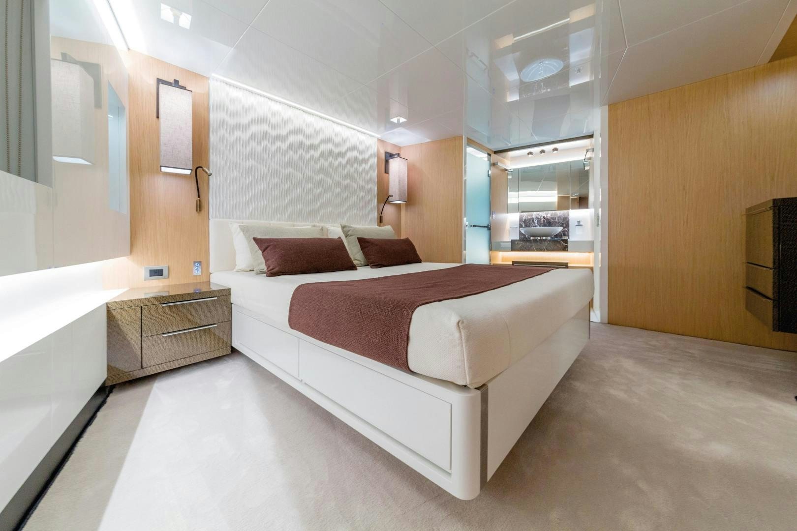 a large bedroom with a bed aboard BOOMSHAKALAKA Yacht for Sale