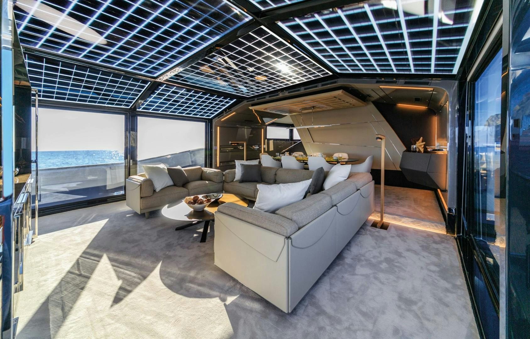 a room with a couch and a table aboard BOOMSHAKALAKA Yacht for Sale