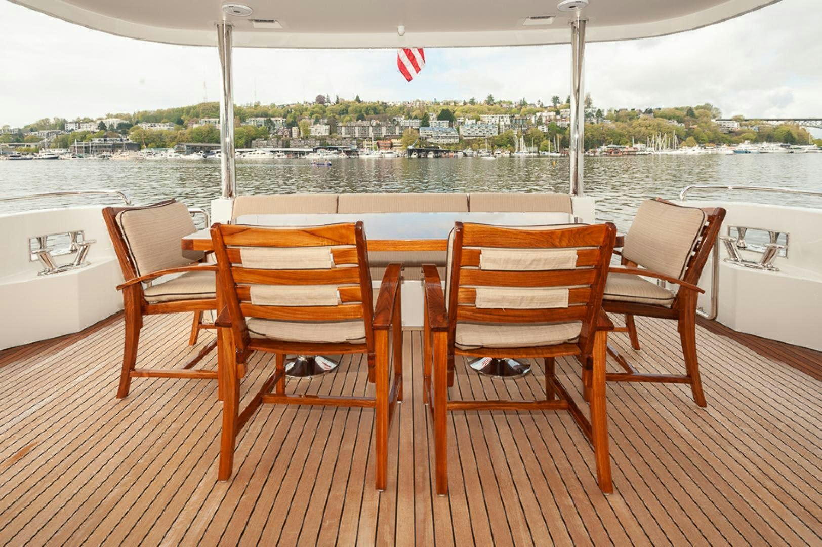 a table and chairs on a deck aboard JEANNE SEA QUA Yacht for Sale
