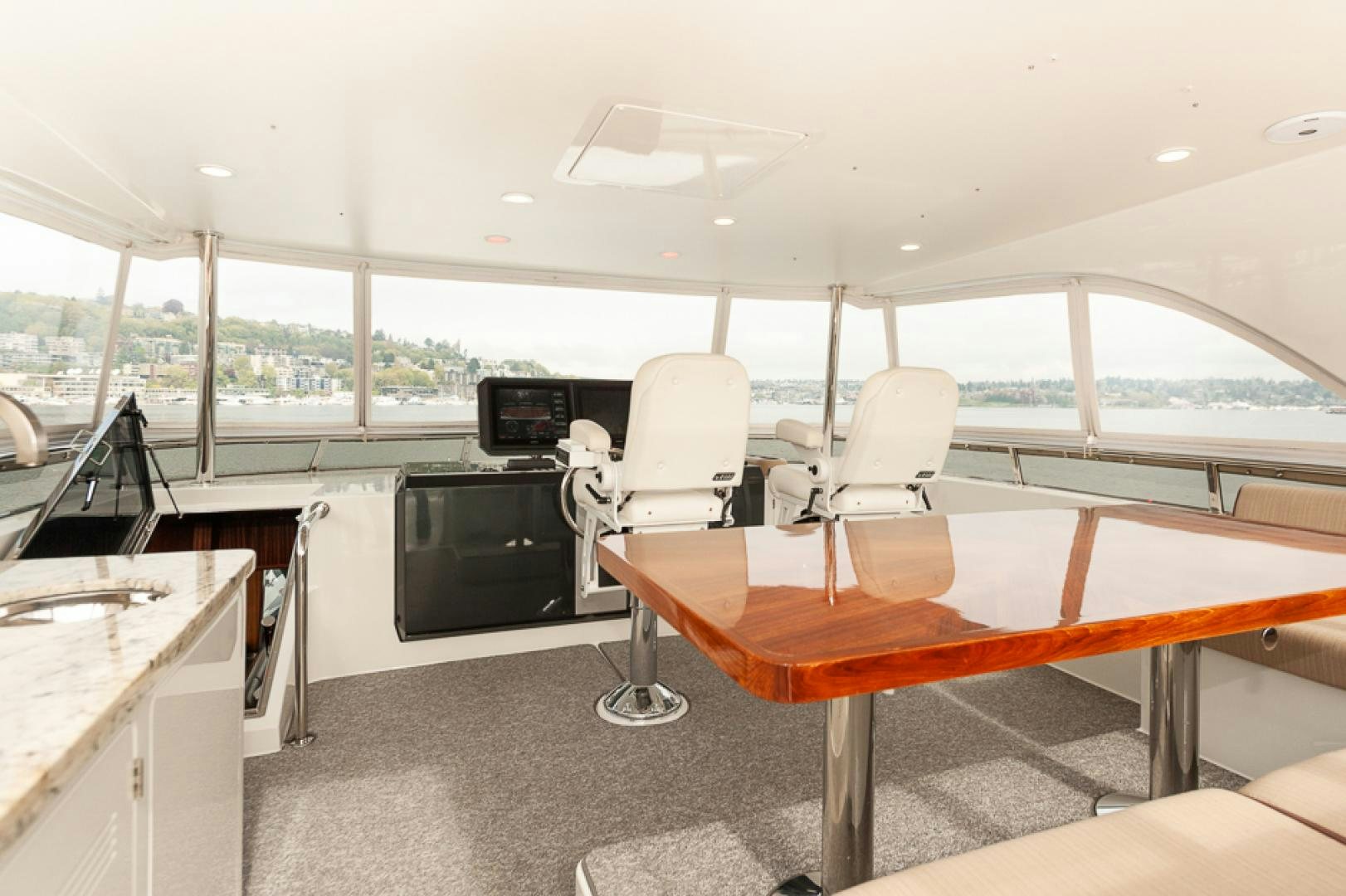 a room with a table and chairs aboard JEANNE SEA QUA Yacht for Sale
