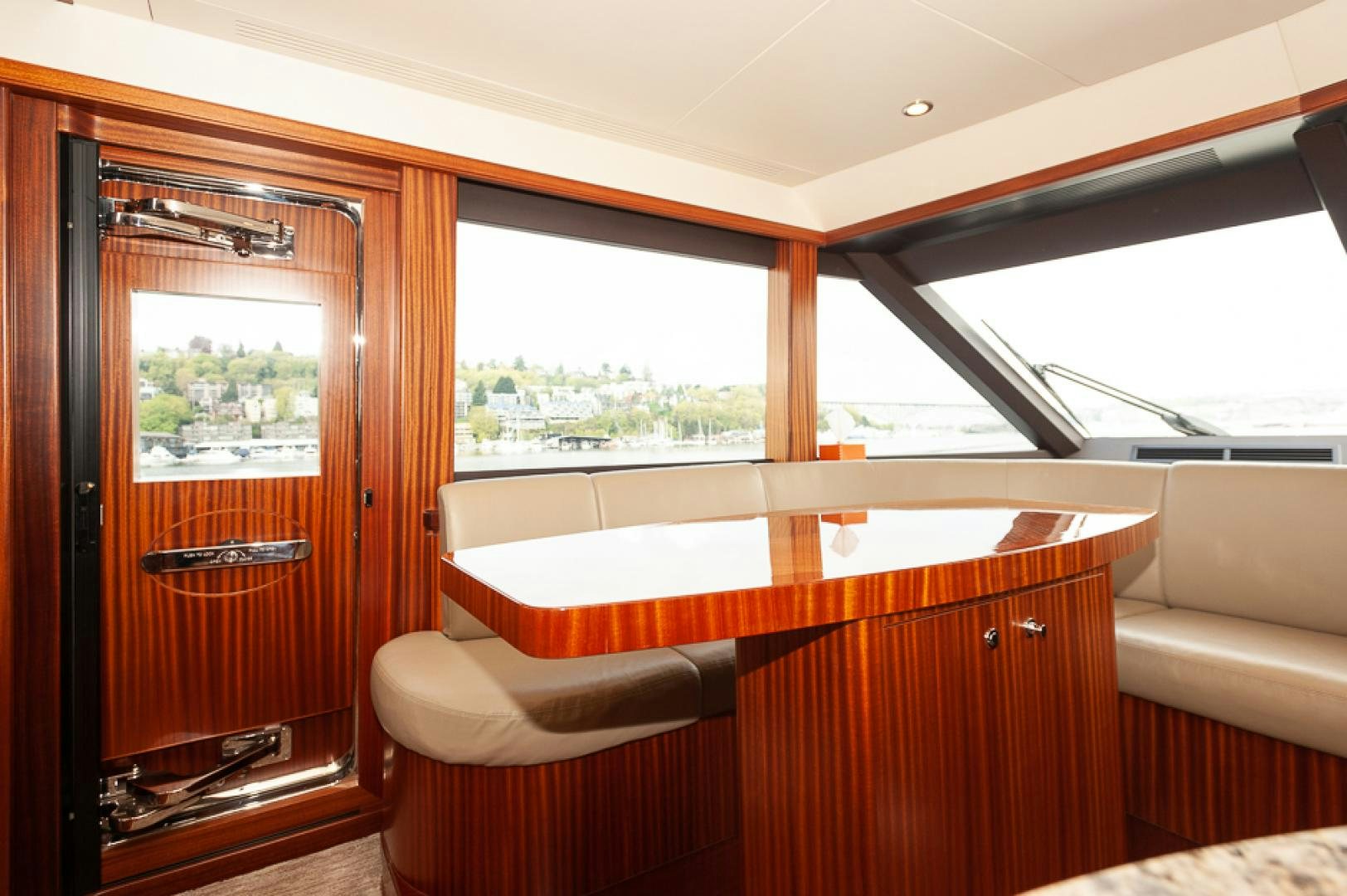 a room with a bed and a window aboard JEANNE SEA QUA Yacht for Sale